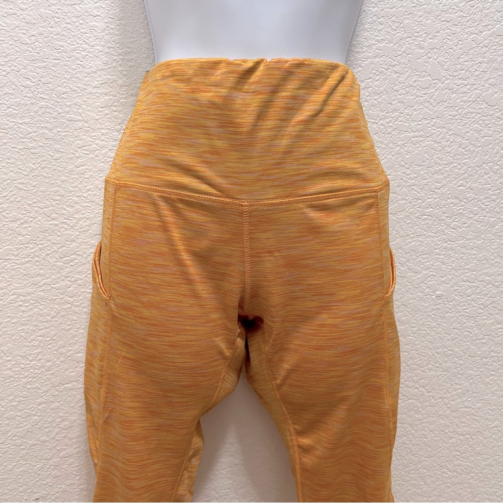 Yellow smooth legging with side pockets for phone, fits 5’4” range, gently used